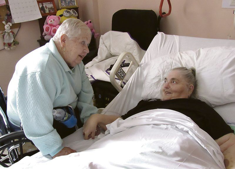 Old buddies reunite at Robinson Terrace after 50 years apart
